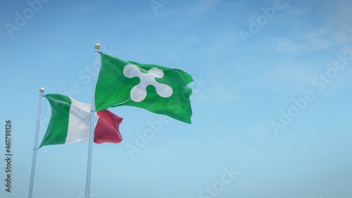 Waving flags of Italy and the Italian region of Lombardia against blue sky backdrop. 3d rendering
