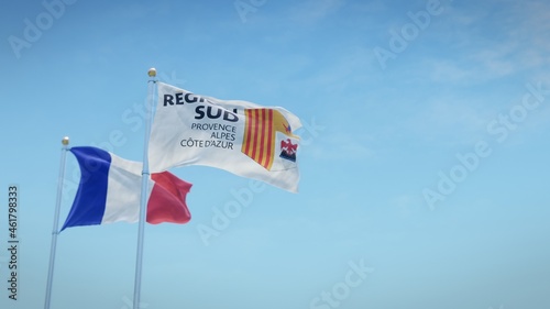 Obraz na plátně Waving flags of France and the logo of the Provence-Alpes-Côte d’Azur region against blue sky backdrop