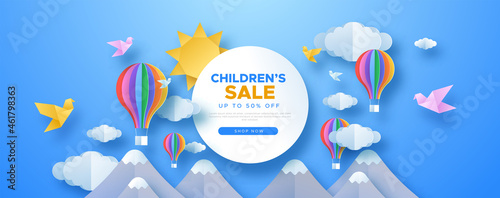 Children sale papercut sky landscape banner with hot air balloon, sun and clouds made in realistic paper craft art. Kid promotion for toy store discount or child care product. photo