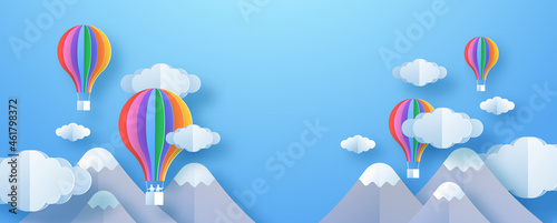 Colorful nature environment illustration in 3d paper cut art style. Creative imagination background or children design backdrop. Papercut sky with clouds, mountain and hot air balloons.