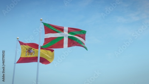 Waving flags of Spain and the autonomous community of Basque Country against blue sky backdrop. 3d rendering photo