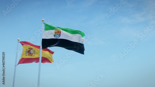 Waving flags of Spain and the autonomous community of Extremadura against blue sky backdrop. 3d rendering photo