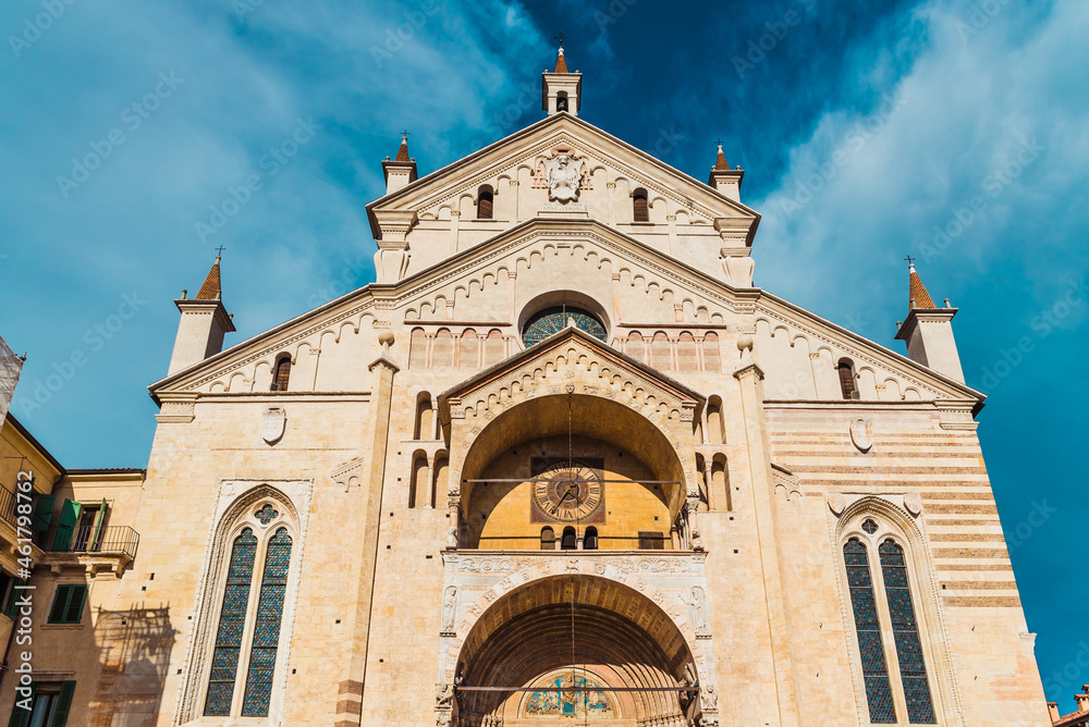 Main facade of the Verona Cathedral, illuminated by the sun.