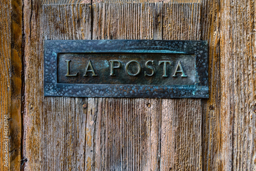 Italian letterbox with the text La Posta, letters in Italian.