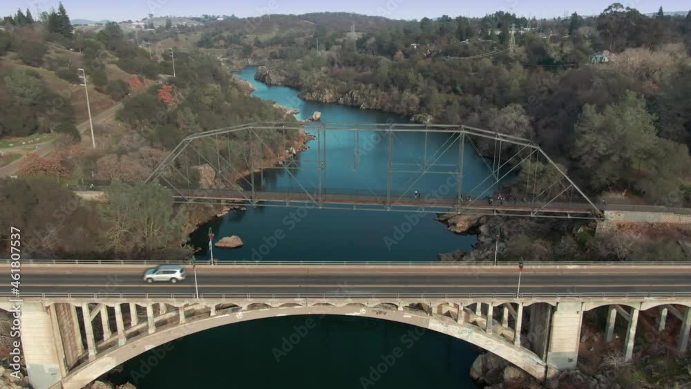 Aerial: Folsom and Rainbow Bridge crossing Lake Natoma, California, USA Aerial: Folsom and Rainbow Bridge crossing Lake Natoma, California, USA