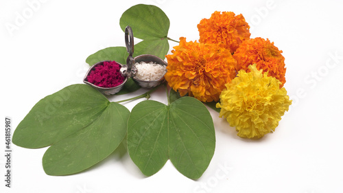 Indian Festival Dussehra, showing golden leaf and flowers on moody background.Greeting card.