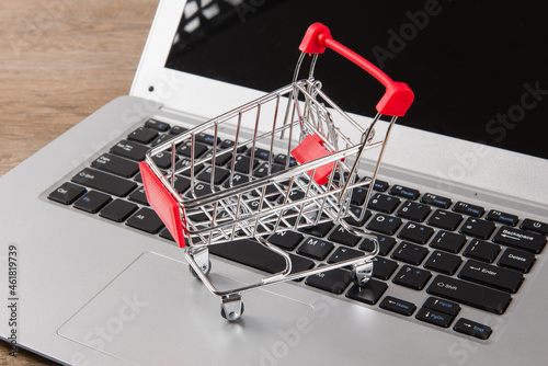 Online shopping concept. shopping cart on laptop