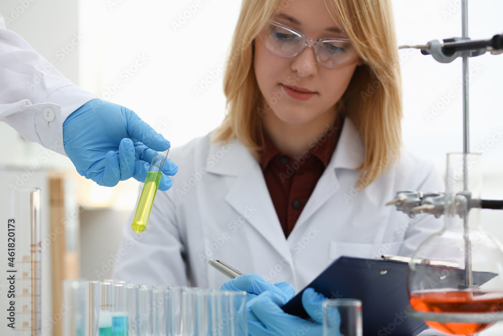 Technician hold in arms in protective gloves Technician hold in arms in protective gloves