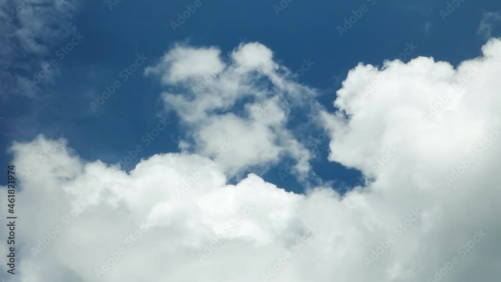Dramatic timelapse of clouds forming against a bright blue sky Dramatic timelapse of clouds forming against a bright blue sky