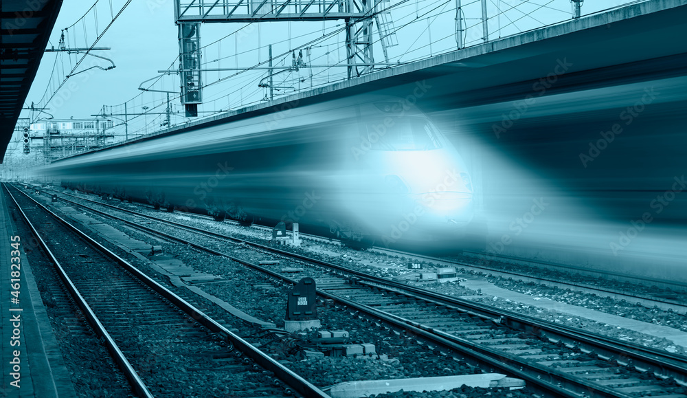 Fototapeta premium High speed train runs on rail tracks - Train in motion