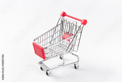 A Empty grocery shopping cart. Isolated on white background