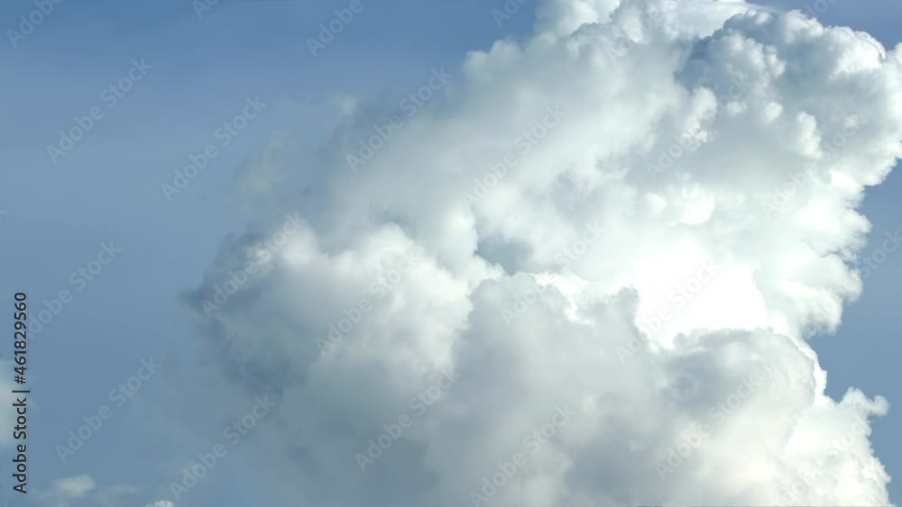 Stunning huge cumulus clouds swirl in the daytime. Timelapse, relaxation weather dramatic beauty atmosphere background Stunning huge cumulus clouds swirl in the daytime. Timelapse, relaxation weather dramatic beauty atmosphere background