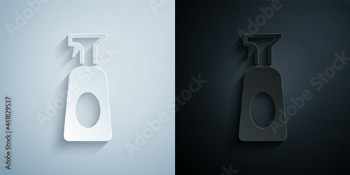 Paper cut Cleaning spray bottle with detergent liquid icon isolated on grey and black background. Paper art style. Vector