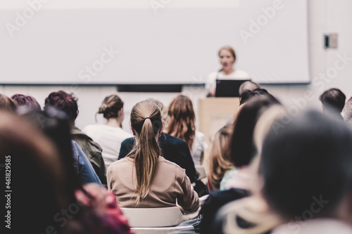 Woman giving presentation on business conference event