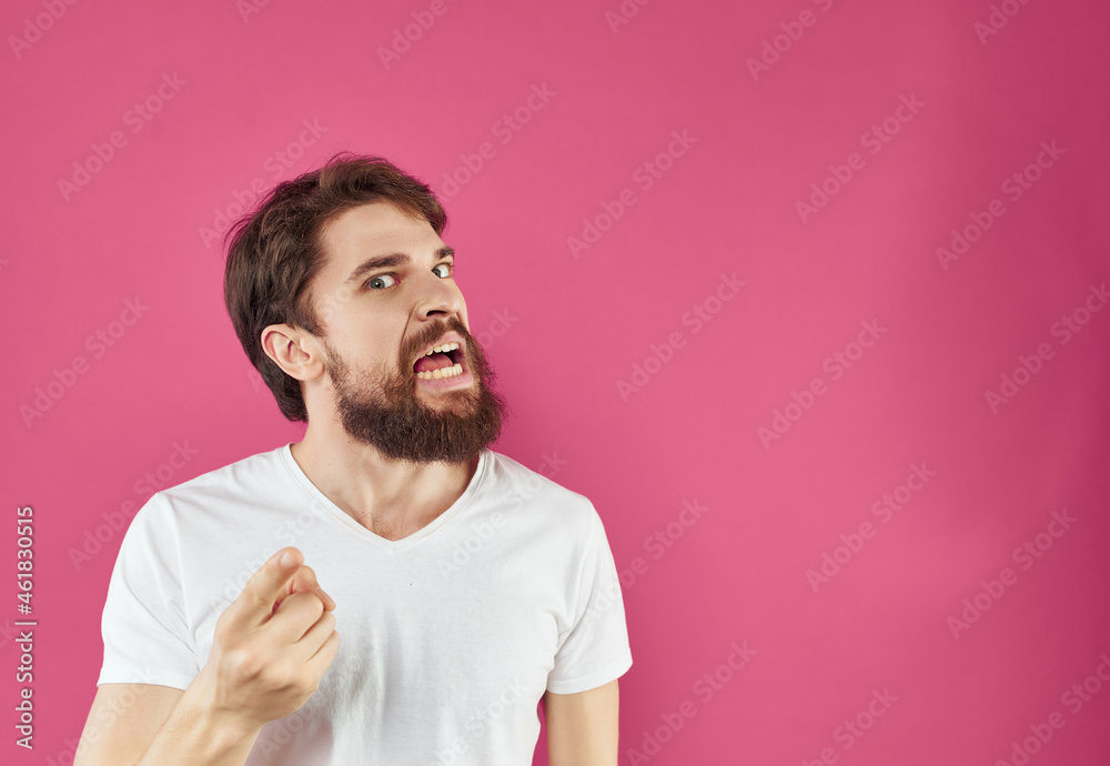 bearded man in a white t-shirt surprised look Lifestyle bearded man in a white t-shirt surprised look Lifestyle