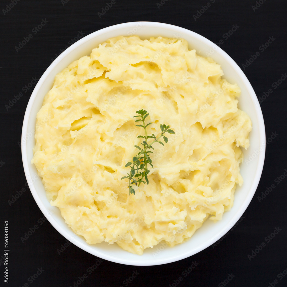 Homemade Garlic Mashed Potatoes on a black background, top view. Flat lay, overhead, from above. Homemade Garlic Mashed Potatoes on a black background, top view. Flat lay, overhead, from above.