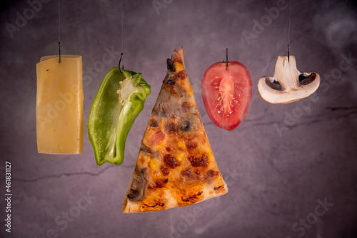 Slice of mozzarella pizza tomato cheese peeper and mushroom ingredients