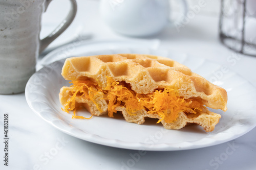 Thai foi thong waffles in white plate and coffee mug snack concept