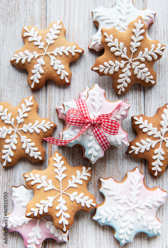 Christmas gingerbread cookies on white wooden background