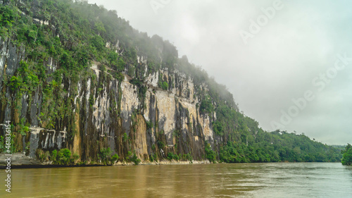 Batu Dinding, iconic landscape of limestone wall on the upper Mahakam riverbank. Beautiful landscape of karst on the riverbank photo