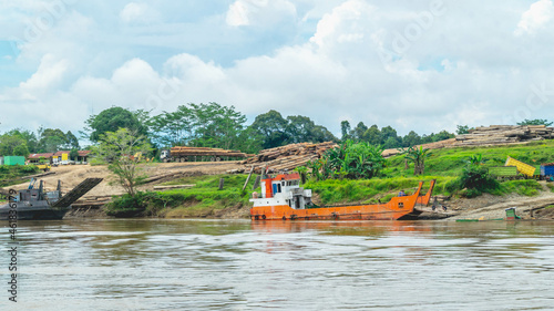 Log yard of tropical rainforest timber at Mahakam Riverbank, Borneo, Indonesia