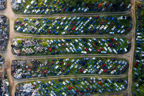 Aerial top down view of scrap cars in a park