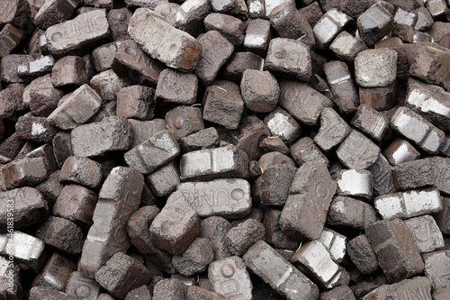 фотографія Closeup view of black charcoal, coal briquets