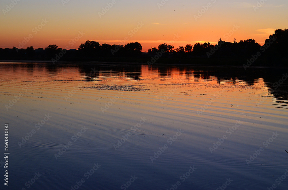 Fototapeta premium Sunset on the river in summer