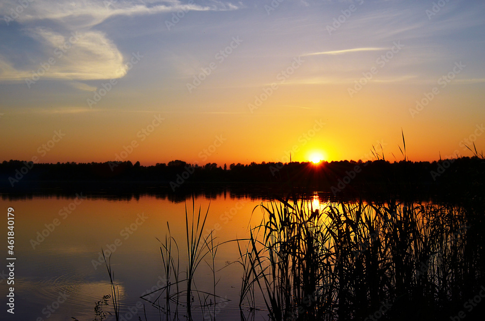 Sunset on the river in summer