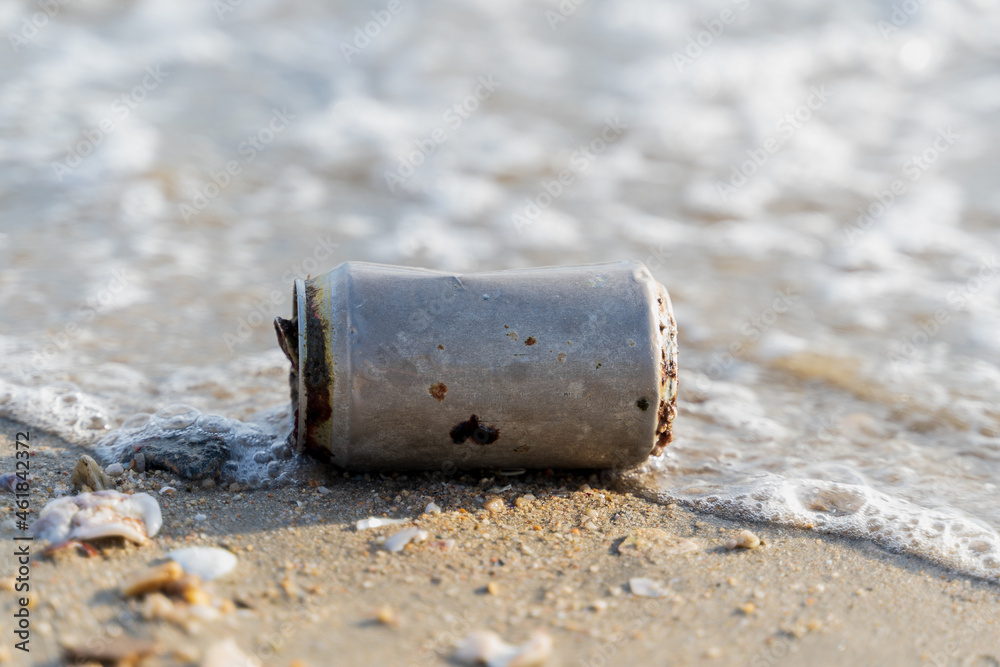 Old rusty Beverage can left on the beach, elective focus, Horizontal orientation, copy space, trash, litter, can, garbage, rubbish, sea, pollute, metal, sand, aluminum. Old rusty Beverage can left on the beach, elective focus, Horizontal orientation, copy space, trash, litter, can, garbage, rubbish, sea, pollute, metal, sand, aluminum.