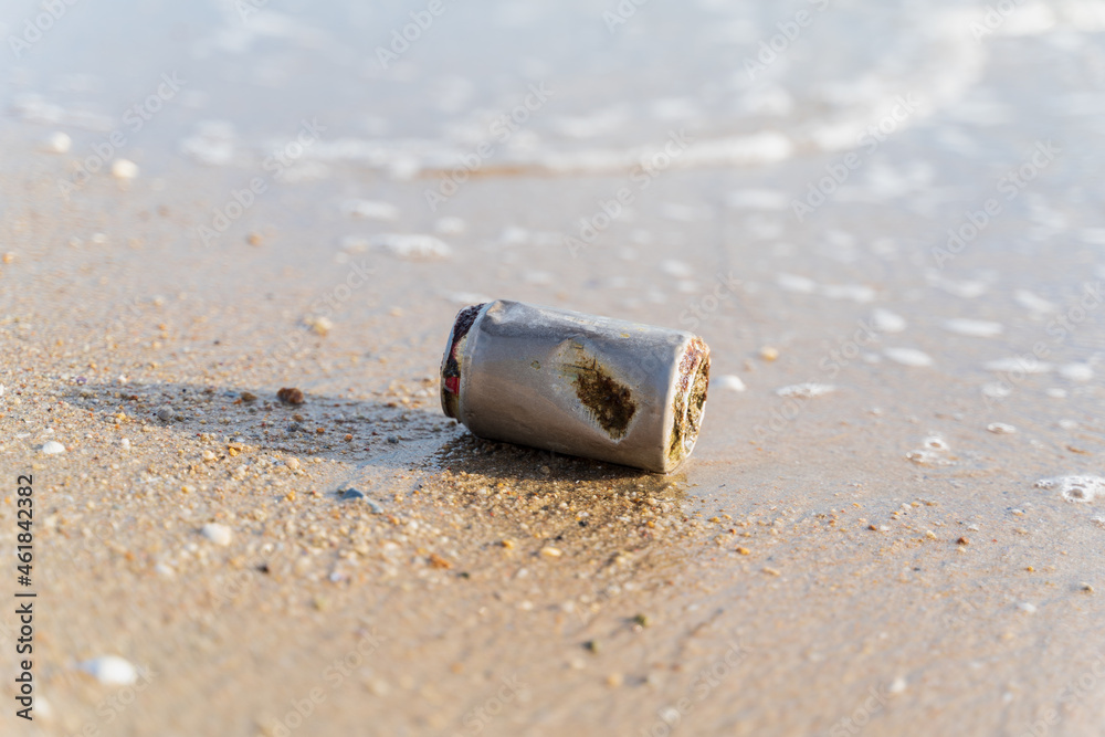 Old rusty Beverage can left on the beach, elective focus, Horizontal orientation, copy space, trash, litter, can, garbage, rubbish, sea, pollute, metal, sand, aluminum.