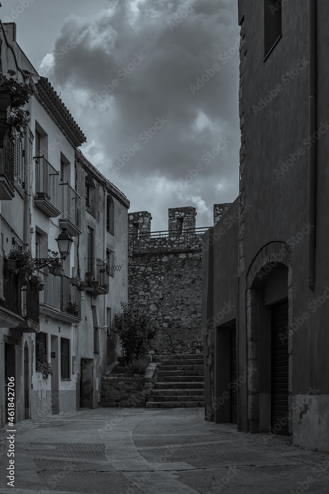 Black white picture of the fortified town Montblanc in Tarragona, Catalunya, Spain, vertical