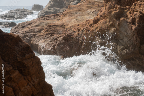 sea waves crashing on rocks near coastline. High quality 4k footage