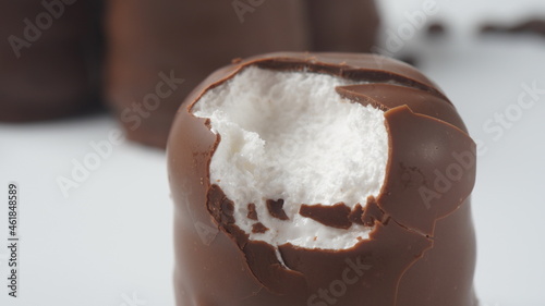 White Chocolate Krembo on the table. A chocolate-coated marshmallow treat that is popular in Israel. photo