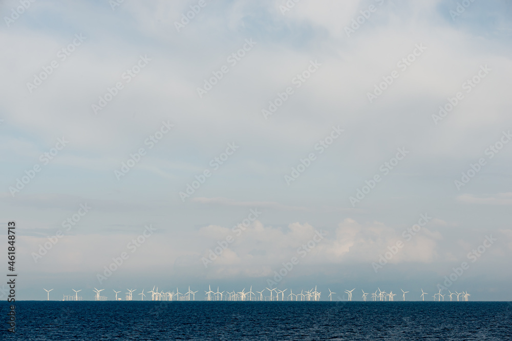 Windmills on the sea with copy space