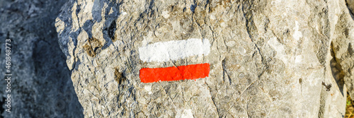 Red and white markers that mark out the traditional french hiking trails on the Montagne Sainte-Victoire trail photo