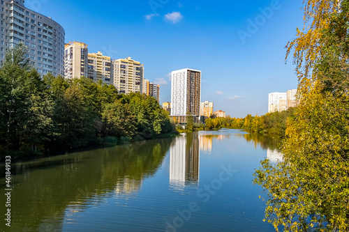 Pushkino, Russia, October 8, 2021. New multi-storey residential buildings on the banks of the Serebryanka river. Autumn landscape