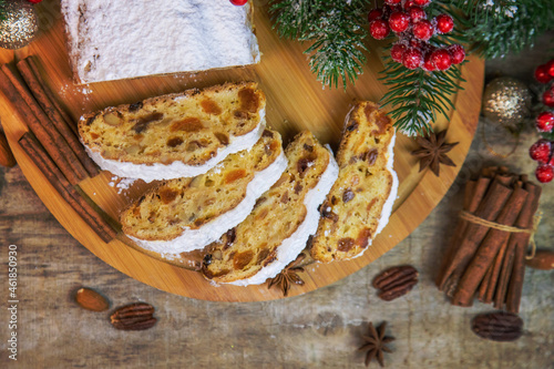 Fototapeta Naklejka Na Ścianę i Meble -  Stollen Christmas cake on the table. Selective focus.