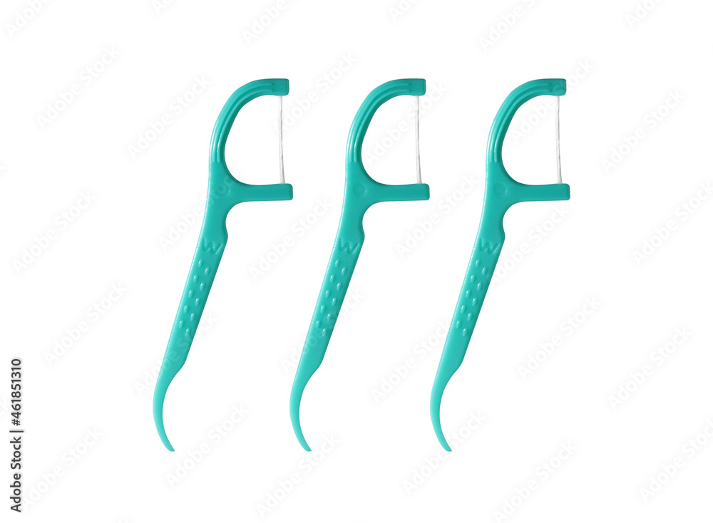 3 Green Dental Floss Picks (Plastic) isolated on a white background. Dental floss with handle, easy to use. 3 Green Dental Floss Picks (Plastic) isolated on a white background. Dental floss with handle, easy to use.
