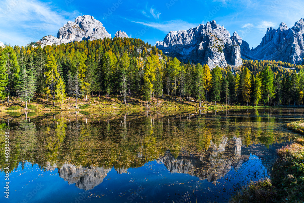 Autumn colors on the lake of Antorno. Magical glimpses of the Dolomites. Three peaks of Lavaredo