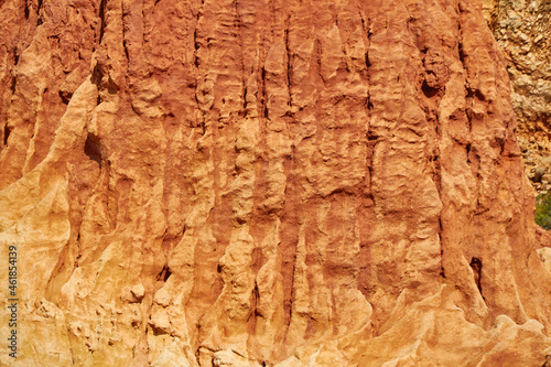 Texture of a reddish stone wall