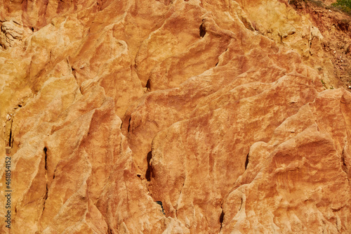 Texture of a reddish stone wall