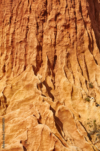 Texture of a reddish stone wall
