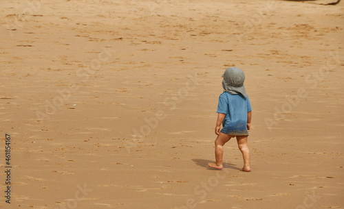 person walking on beach