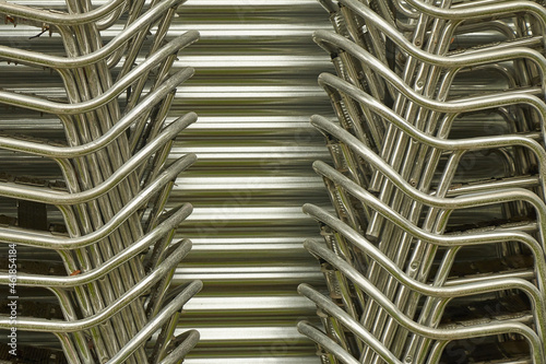 Chairs stacked forming rhythm