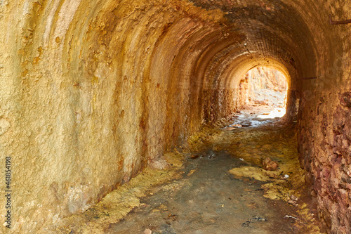 Reddish-hued mine or cavern entrance