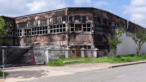 Fire Arson Building Factory Warehouse Damaged Close-Up Structure in Riots Political Unrest . photo