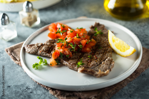 Grilled beef steak with tomato salsa