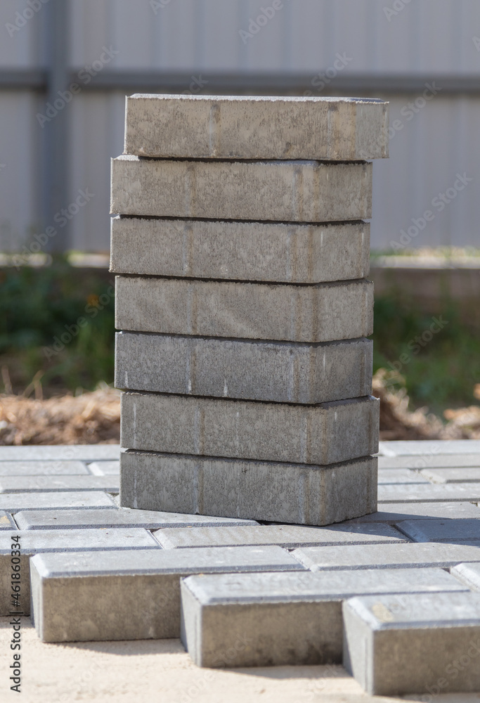 Laying paving slabs at a construction site. Laying paving slabs at a construction site.