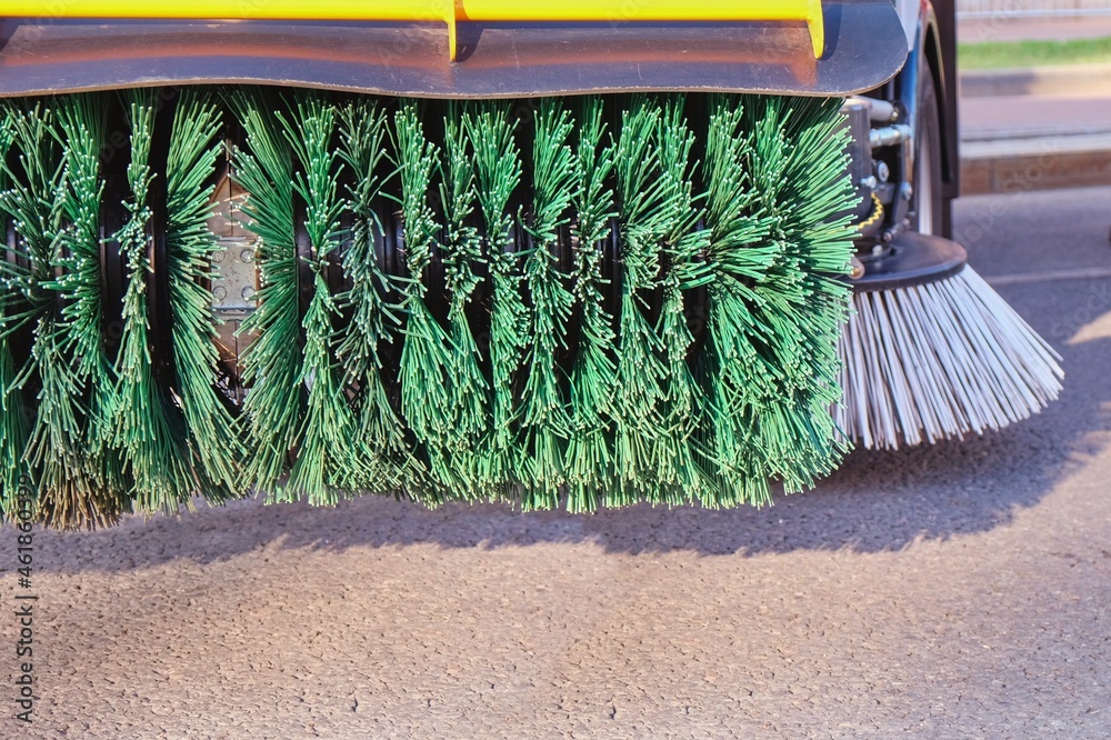 Rotating new brush of street sweeper cleaning machine.Big round broom